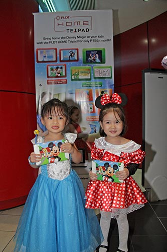 Kids in their favorite costumes with their Mickey Mouse-themed Telpads.