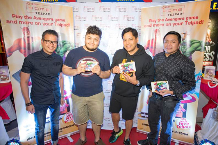 Concert king Martin Nievera (2nd from right) and son Ram (2nd from left) are joined by PLDT Vice President and Home Voice Solutions Patrick Tang (left) and PLDT Vice President and Head of Home Marketing Gary Dujali (right)