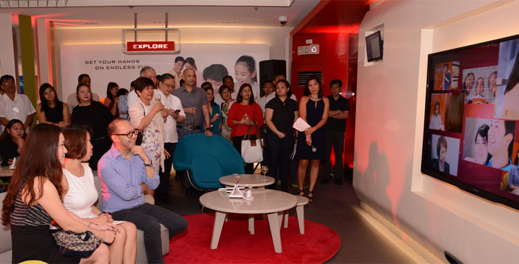 Guests watch an presentation on the transformation of the Pasay Sales & Service Center from the traditional business office to the state of the art flagship store