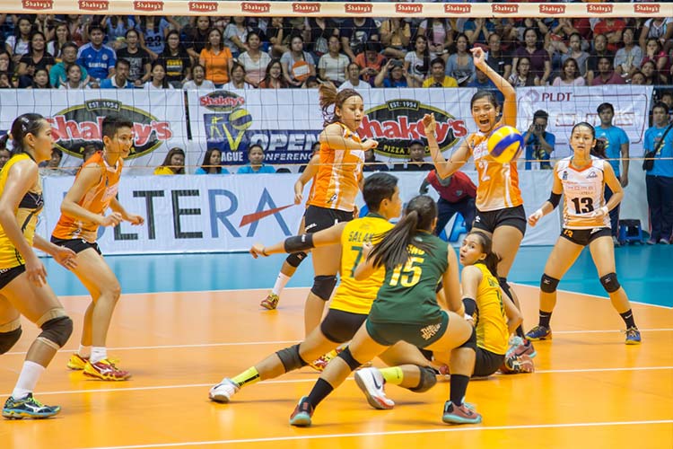 The PLDT Home Ultera Ultra Fast Hitters look on as the Philippine Army Lady Troopers try to save the ball in Game 3 of the Shakey’s V-League Open Conference finals at the FilOil Flying V Arena. 