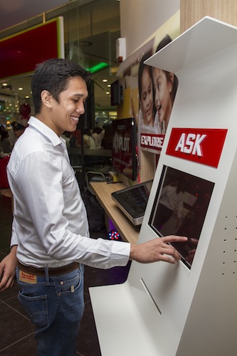 PLDT Customer Care Assistants try out the new digital screens in the store