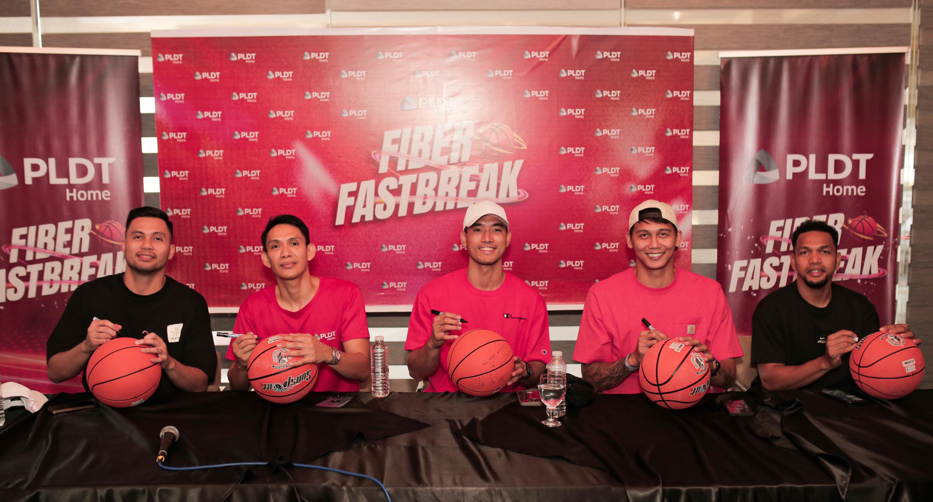 The PLDT Fiber Fastbreak star players sign basketballs to be gifted to lucky PLDT Home customers.